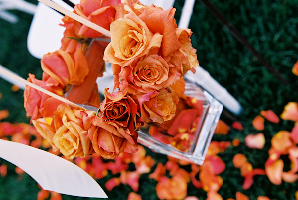 orange and coral flowers wedding photo by Yvette Roman Photography